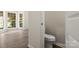 Charming powder room bathed in natural light with great window views at 3429 Lazy Day Ln, Charlotte, NC 28269