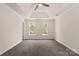 Spacious, bright bedroom with soft carpet, tray ceiling and great natural light at 3429 Lazy Day Ln, Charlotte, NC 28269