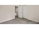 This is a bedroom with neutral walls, carpet flooring, and closet doors at 3429 Lazy Day Ln, Charlotte, NC 28269
