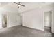 Bright primary bedroom features tray ceilings, carpet, and closet access at 3429 Lazy Day Ln, Charlotte, NC 28269