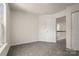 This is a bedroom with neutral walls, carpet flooring, closet and is naturally well lit at 3429 Lazy Day Ln, Charlotte, NC 28269