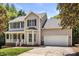 Charming two-story home with a two-car garage and a well-maintained lawn at 3429 Lazy Day Ln, Charlotte, NC 28269