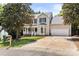 Charming two-story home featuring a welcoming porch and attached two-car garage at 3429 Lazy Day Ln, Charlotte, NC 28269
