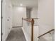 Hallway with plush carpet, a wood railing, and great natural light at 3429 Lazy Day Ln, Charlotte, NC 28269
