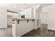 Bright eat-in kitchen featuring white cabinetry and hardwood floors at 3429 Lazy Day Ln, Charlotte, NC 28269