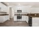 Well-lit kitchen showcasing white cabinets, stainless steel appliances, and a stylish countertop at 3429 Lazy Day Ln, Charlotte, NC 28269