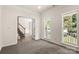 Inviting living room with natural light and a staircase view at 3429 Lazy Day Ln, Charlotte, NC 28269