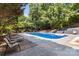 Relaxing pool with seating, perfect for summer days and backyard entertainment at 3429 Lazy Day Ln, Charlotte, NC 28269