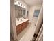 Well-lit bathroom with a large mirror, vanity, and ample cabinet space at 35 Wittenburg Springs Dr, Taylorsville, NC 28681