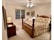 Comfortable bedroom with a floral patterned bedspread, soft lighting, and a ceiling fan at 35 Wittenburg Springs Dr, Taylorsville, NC 28681