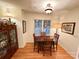 Classic dining room with hardwood floors, a wooden table, and a window with blinds at 35 Wittenburg Springs Dr, Taylorsville, NC 28681