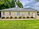 Side view showcasing manicured shrubs along the house's exterior at 35 Wittenburg Springs Dr, Taylorsville, NC 28681