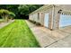 Side view of the garage showing its entrance and landscaped walkway at 35 Wittenburg Springs Dr, Taylorsville, NC 28681