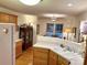 Open concept kitchen with hardwood floors, a view into the dining area, and white appliances at 35 Wittenburg Springs Dr, Taylorsville, NC 28681