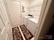 Functional laundry room equipped with a washer, dryer, and overhead shelving at 35 Wittenburg Springs Dr, Taylorsville, NC 28681