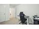 Bedroom with a black desk, gaming chair, HP printer, and gray carpet flooring at 3951 Tersk Dr, Midland, NC 28107