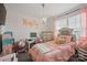 bedroom features pink accents, decorative chandelier, and a study desk at 3951 Tersk Dr, Midland, NC 28107