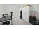 Bedroom with a black desk, gaming chair, storage cabinets and gray carpet flooring at 3951 Tersk Dr, Midland, NC 28107
