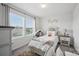Bedroom with a large window, showcasing neighborhood views at 3951 Tersk Dr, Midland, NC 28107