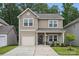 Charming two-story home with a well-maintained lawn and inviting front porch at 3951 Tersk Dr, Midland, NC 28107