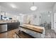 Open-concept kitchen with stainless steel appliances and an adjacent dining and living area at 3951 Tersk Dr, Midland, NC 28107