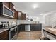 Well-lit kitchen featuring stainless steel appliances, granite countertops, and ample cabinet space at 3951 Tersk Dr, Midland, NC 28107
