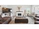 Comfortable living room with a decorative fireplace, plush seating and ottoman at 3951 Tersk Dr, Midland, NC 28107