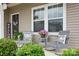 Cozy front porch featuring rocking chairs and decorative plants, perfect for relaxing at 3951 Tersk Dr, Midland, NC 28107