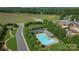 Aerial view showcases the community pool with lounge area and well-manicured landscaping at 4797 Chesney Nw St, Concord, NC 28027