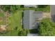 Aerial view of house showcasing the roof, backyard, and surrounding trees at 4797 Chesney Nw St, Concord, NC 28027