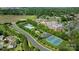 Beautiful aerial view of community amenities including a pool, tennis court, and well-maintained green spaces at 4797 Chesney Nw St, Concord, NC 28027