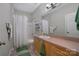 Bathroom with tub/shower, vanity with sink, and large mirror in neutral tones at 4797 Chesney Nw St, Concord, NC 28027