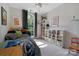 Well-lit bedroom featuring a patterned rug, window, and built-in storage units at 4797 Chesney Nw St, Concord, NC 28027