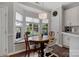 Bright breakfast nook features bay window, hardwood floors, and modern lighting at 4797 Chesney Nw St, Concord, NC 28027