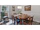 Traditional dining room with hardwood floors, wainscoting, and a large window at 4797 Chesney Nw St, Concord, NC 28027