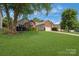 Beautiful home with a large front lawn, mature trees and a two-car garage at 4797 Chesney Nw St, Concord, NC 28027