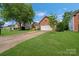 Beautiful home with a large front lawn, mature trees and a two-car garage at 4797 Chesney Nw St, Concord, NC 28027