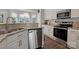 Modern kitchen featuring stainless steel appliances, granite countertops, and subway tile at 4797 Chesney Nw St, Concord, NC 28027