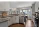 Modern kitchen featuring stainless steel appliances, granite countertops, and ample cabinet space at 4797 Chesney Nw St, Concord, NC 28027