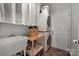 Laundry room with washer, dryer, and sink with shelf; door to the exterior at 4797 Chesney Nw St, Concord, NC 28027