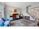 Cozy living room with a vintage desk, a staircase, and hardwood floors at 4797 Chesney Nw St, Concord, NC 28027