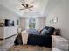 Inviting main bedroom featuring a trey ceiling, large window, and neutral color palette at 4797 Chesney Nw St, Concord, NC 28027