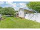 Well-maintained backyard featuring a spacious lawn, privacy fence, and covered patio area at 502 Roxanne Nw Ct, Concord, NC 28027