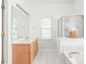 Bright bathroom with a long vanity, a soaking tub, and a separate shower at 502 Roxanne Nw Ct, Concord, NC 28027