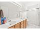 Bright bathroom featuring double sinks and a bathtub with shower at 502 Roxanne Nw Ct, Concord, NC 28027