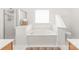 Relaxing primary bathroom featuring a large soaking tub and a separate shower at 502 Roxanne Nw Ct, Concord, NC 28027