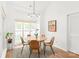 Charming dining area with modern lighting and a view to the outside at 502 Roxanne Nw Ct, Concord, NC 28027
