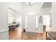 Bright foyer showcasing hardwood floors, high ceilings, and open views to living and dining areas at 502 Roxanne Nw Ct, Concord, NC 28027