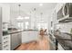 Updated kitchen with stainless steel appliances, granite counters, and white cabinets at 502 Roxanne Nw Ct, Concord, NC 28027