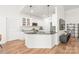 Bright kitchen featuring white cabinetry and black countertops at 502 Roxanne Nw Ct, Concord, NC 28027